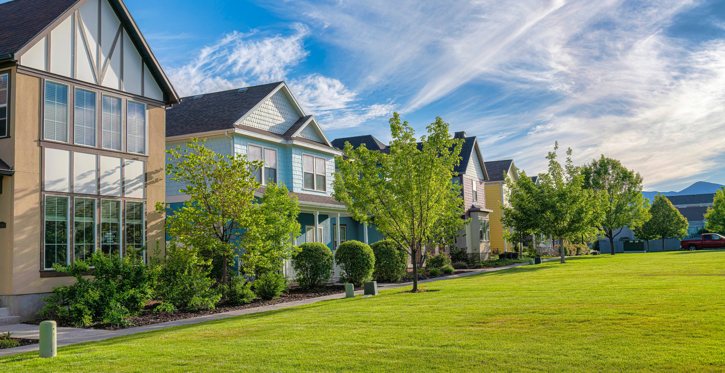 Suburban homes with conventional grass lawns — the industry being disrupted